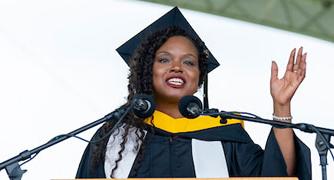 Image of a graduate speaking at the commencement ceremony.