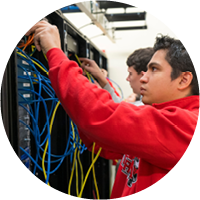 Image of a student working in a networking lab.